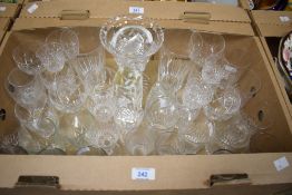 A collection of assorted cut glass drinking glasses, a cut glass vase, a Mats Jonasson signature
