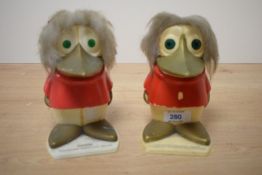 A pair of novelty TSB plastic duck money banks, one holding coins, h15cm