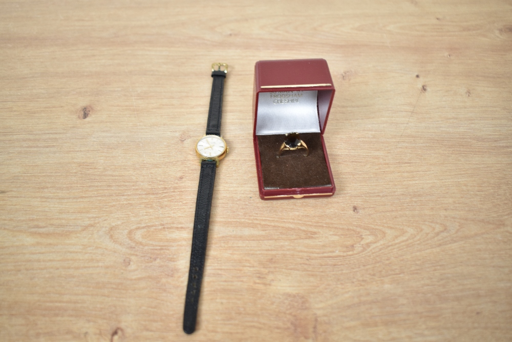 A lady's gold plated Montine wrist watch having baton numeral dial to champagne face in circular