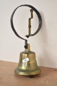 A large early 20th century brass door bell, h40cm