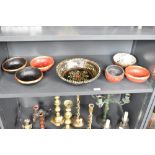 A paper mache fruit bowl, hand painted with floral patterns on a black ground, w25cm, sold