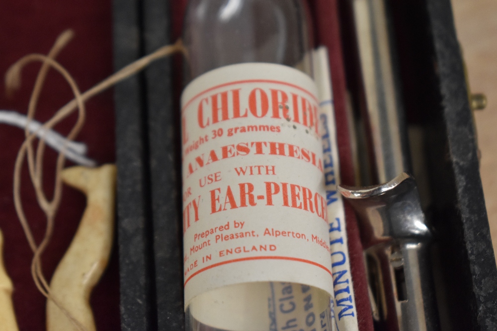 A vintage ear piercing kit, sold together with a pair of 9ct gold stud earrings weighing approx. 0. - Image 3 of 3