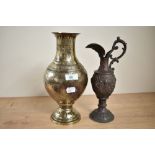 An early 20th century Middle Eastern brass vase of lobed form, decorated with hunting scenes, h28.