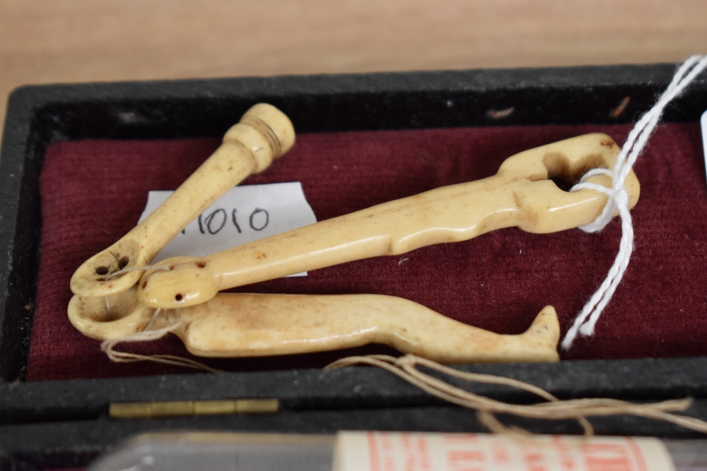 A vintage ear piercing kit, sold together with a pair of 9ct gold stud earrings weighing approx. 0. - Image 2 of 3