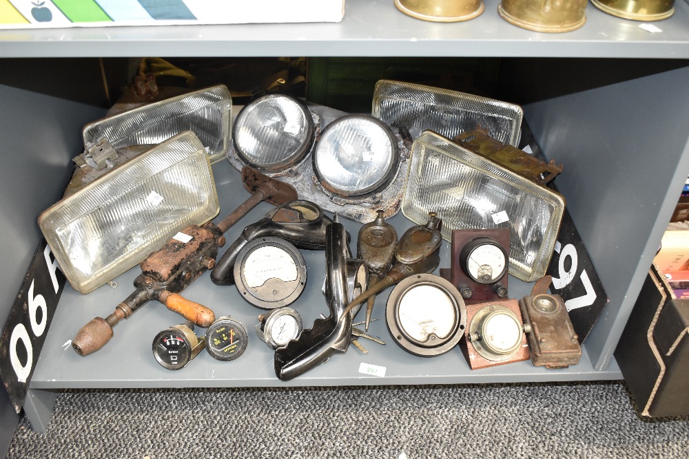 A pair of high rate discharge testers, sold together with a pair of oil cans, head lamps, number