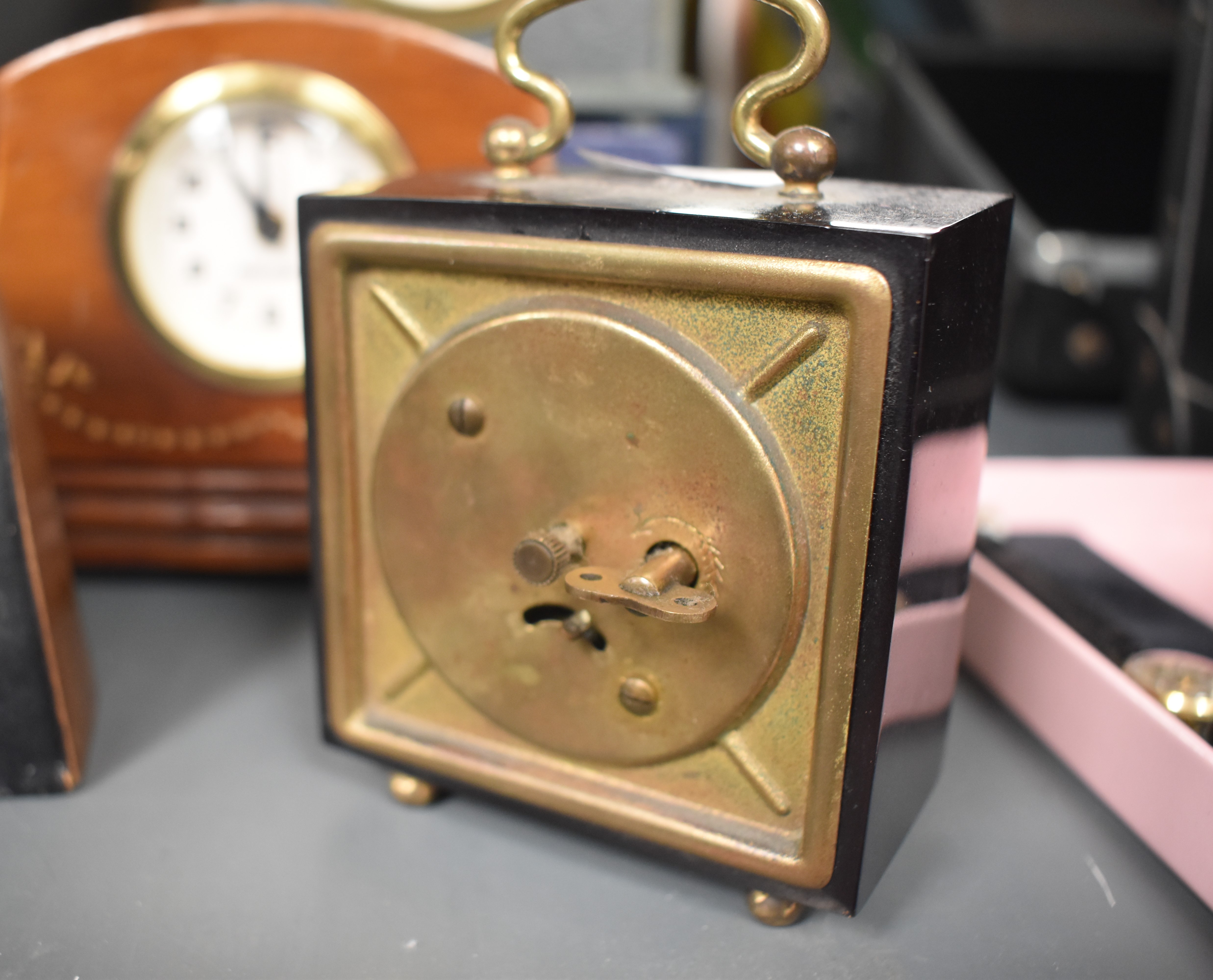 An early 20th century deep red bakelite miniature travel clock, H10cm, sold together with various - Image 3 of 5