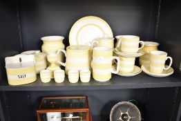 A collection of Cornishware kitchenalia, decorated in yellow and white bands, to include coffee pot,