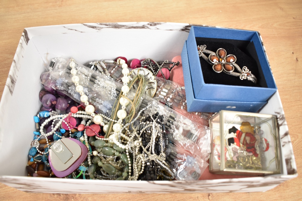 An assortment of costume jewellery, including statement pieces, beaded jewellery and faux pearls,