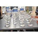 A set of 23 Babycham glasses, having gilt colour rims with yellow baby logo, h10cm
