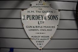Enamelled metal shield shape sign 'By Royal Appointment to H M the Queen, J Purdey & Sons Ltd. Gun &