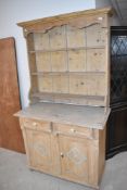 A rustic pine part painted sideboard, with matched pine delft rack, width approx. 105cm, height