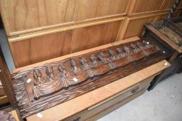 A vintage carved panel depicting last supper, width approx. 123 x 29cm