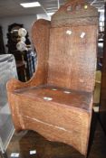 A 19th Century oak childs rocking chair, lambing style, width approx. 37cm