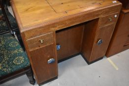 A repurposed part oak sewing table , with animalistic and agate style handles