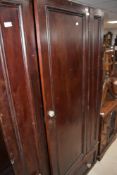 A Victorian stained frame wardrobe (no top)