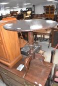 A 19th Century mahogany pedestal table having circular snap top, turned column and triple splay