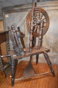 A traditional oak spinning wheel