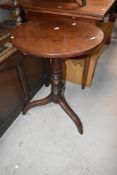 A 19th Century mahogany pedestal occasional table having circular top, turned column and triple