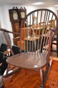 A dark stained Ercol rocking armchair