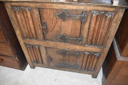 An early 20th Century oak double side cabinet, with linen fold decoration, width approx. 92cm