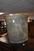 An Antique animal skin bucket, height approx. 40cm