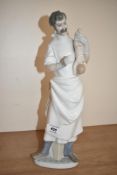 A large Lladro porcelain figure group number 4763, 'Obstetrician' Doctor with new born baby,