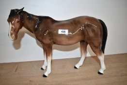 A large Melba Ware porcelain horse in brown gloss finish, measuring 30cm tall.