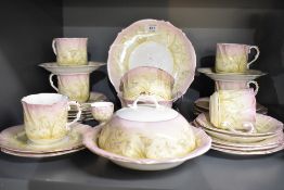 A vintage part tea service having pink and cream banding with gilt edging and snowdrop