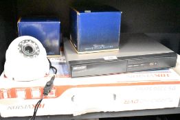 A HIK VISION Turbo HD DVR DS-7200 Series sold along with two CCTV colour cameras.