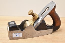 A vintage steel and mahogany infil smoothing plane, lacking makers marks but appears to be a