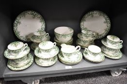 A selection of Victorian Hughes Fenton green transfer printed tea wares, 11 cups, 12 saucers, 11