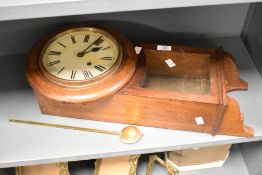 An early 20th century German Winterhalder and Hofmeier oak cased chiming drop-dial wall clock, the