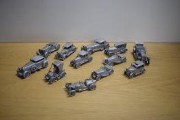 Twelve Danbury Mint 1:43 scale Pewter Vintage Cars, 1924 Vauxhall, 1934 Austin 7, 1931 Daimler