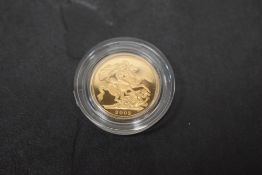 A Royal Mint 2003 Queen Elizabeth II Gold Proof Sovereign, George & Dragon, in plastic capsule and