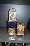 A Smiths brass 8 day lantern clock, having domed bell top, chapter ring and Roman numerals, h15cm,