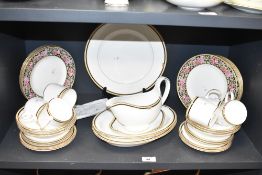 A Wedgewood Clio pattern dinner service, decorated with gold colour edging and floral patterns on