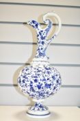 A Coalport blue and white porcelain pitcher having fluted neck raised on a circular base, makers