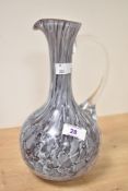 A Murano style marble effect glass pitcher having a clear glass handle, h25cm