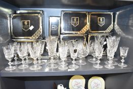 A set of 4 Edinburgh crystal brandy glasses with boxes, having cross cut design and black paper