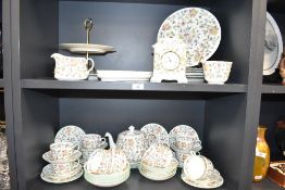 A Haddon Hall 'Minton' pattern bone china tea service, decorated with floral patterns on a white