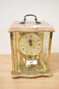 A Haller Quartz Anniversary brass and glass clock, the dial having Roman numerals, h20cm Condition