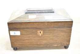 A 19th century tea caddy raised on bun feet, L23cm