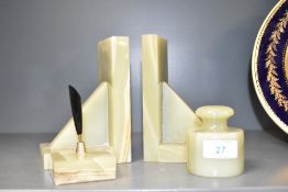 A pair of onyx book ends, h15cm, sold together with a onyx paperweight and a desk top pen tidy, (4)