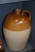 A large stoneware flagon having impressed marks for 'G Braithwaite Jn Wine & Spirit Merchant