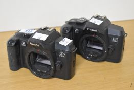 Two Canon EOS 5000 35mm film cameras.