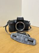 A Canon EOS 750 35mm film camera.