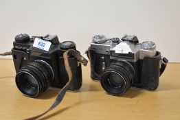 Two Zenit E cameras, one silver and black, the other black, both with Helios 58mm f2 44-2 lenses,