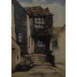 An early/mid 20th century coloured etching 'Smugglers Cottage Polperro' stone coastal cottage with