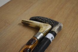 Two small antler handled sticks measuring 85cm long