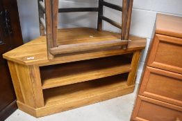 A modern golden oak corner TV unit, width approx. 106cm